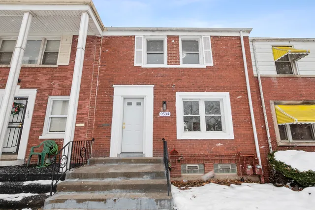 a front view of a building with a street