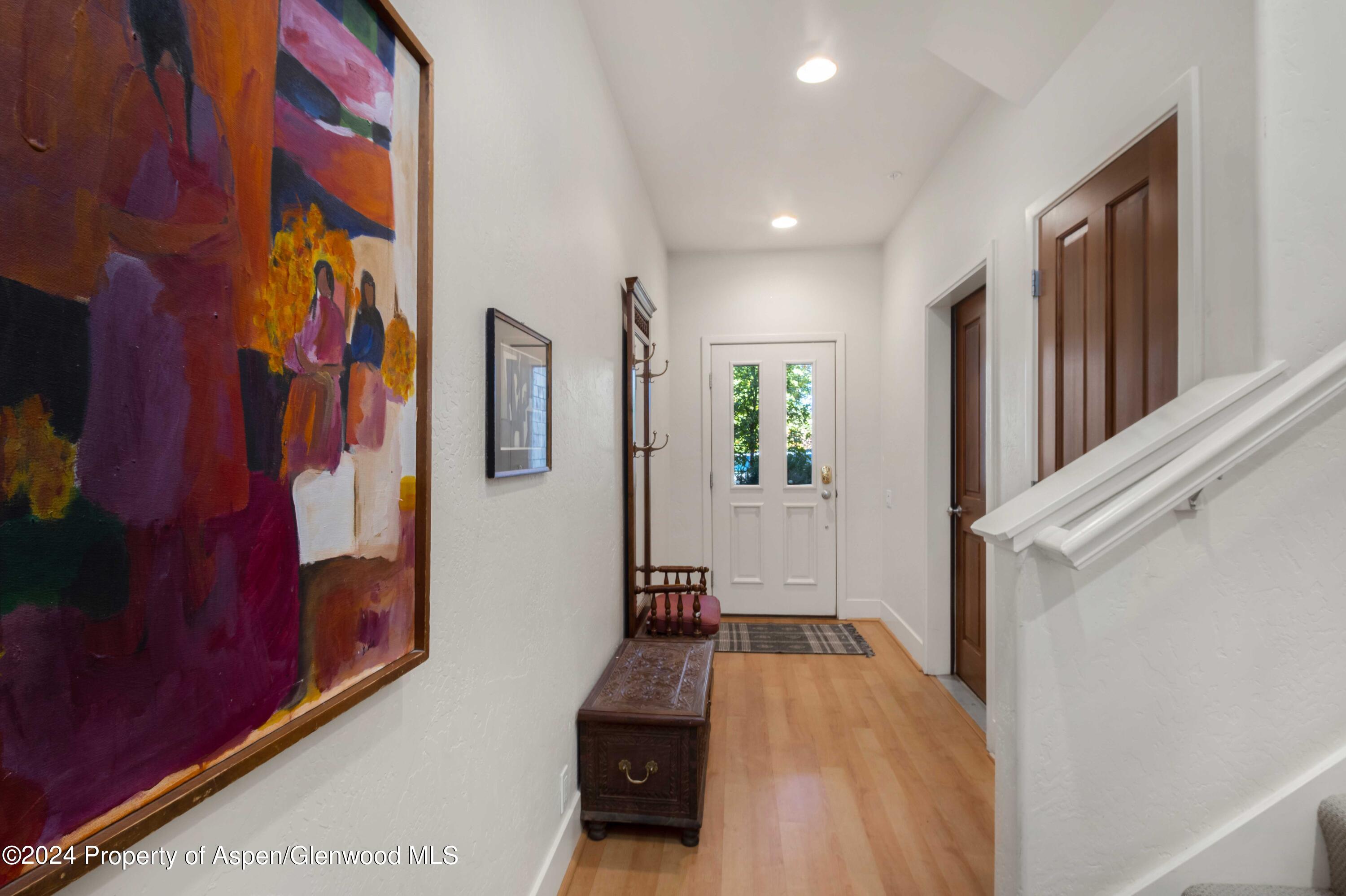 532 Evans Court Basalt, CO 81621 - Photo 16 of 22 a view of a hallway with paintings on the wall