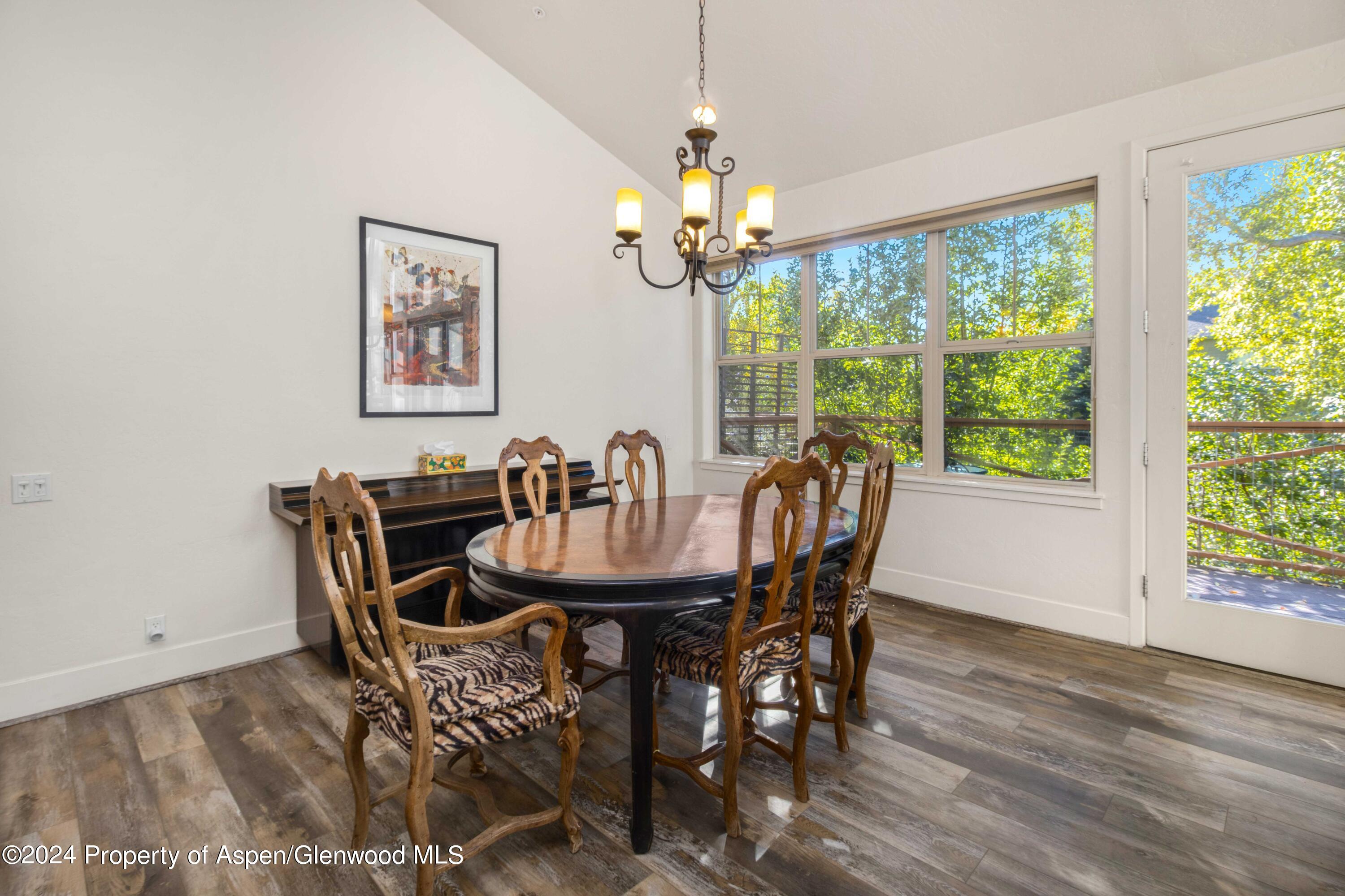 532 Evans Court Basalt, CO 81621 - Photo 9 of 22 a view of a dining room with furniture wooden floor and chandelier