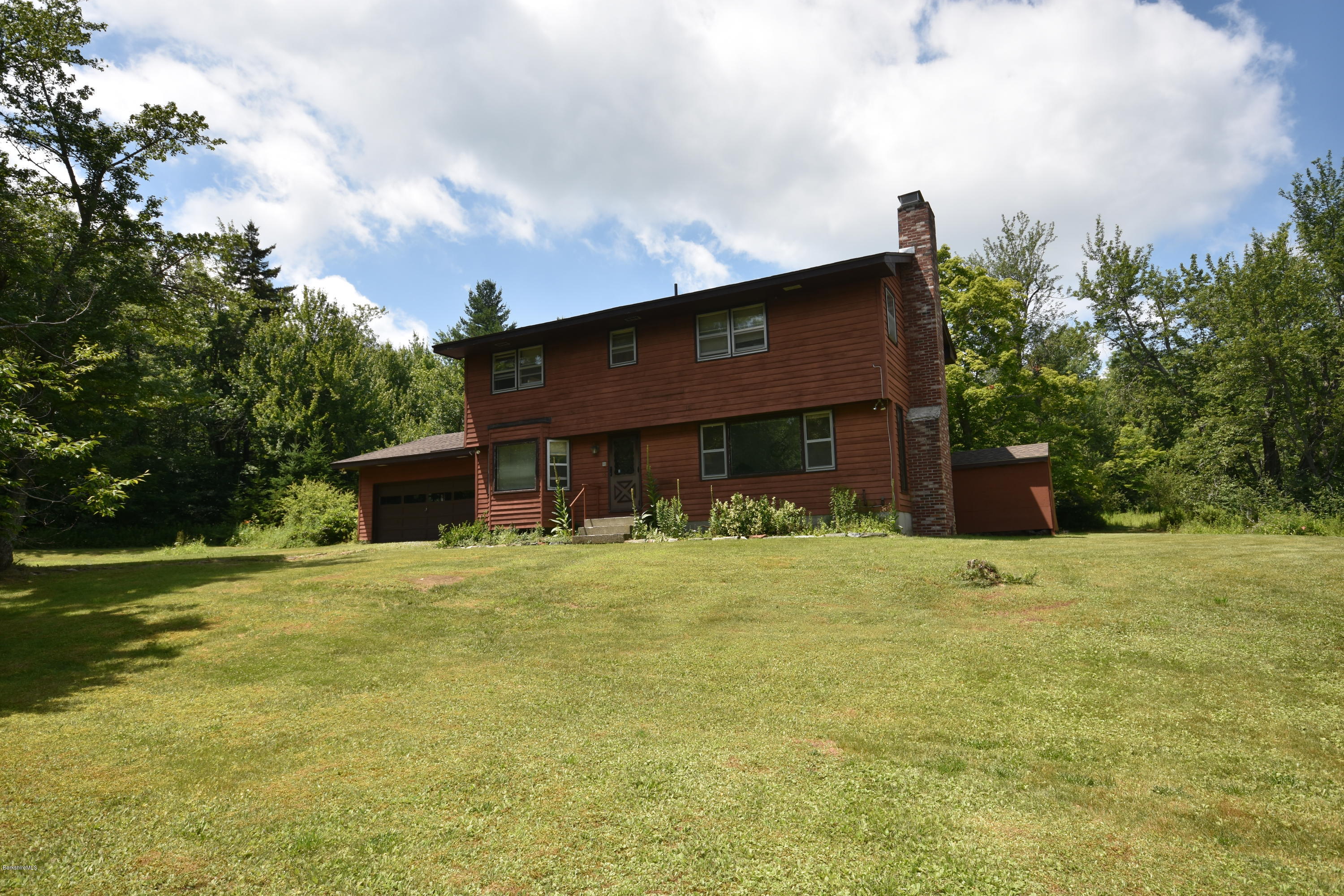 247 East Windsor Road Peru, MA 01235 - Photo 2 of 42 a front view of a house with a yard