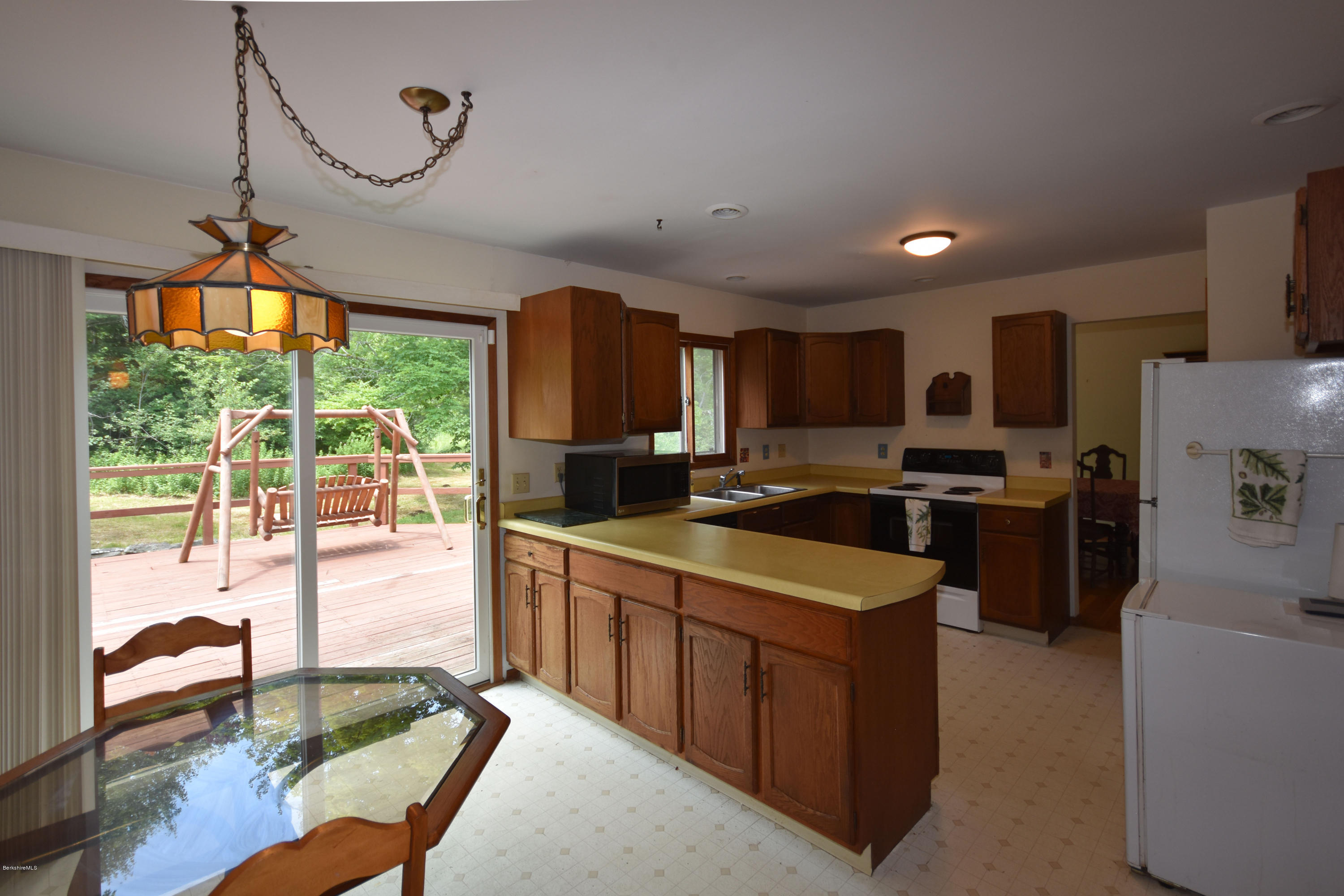 247 East Windsor Road Peru, MA 01235 - Photo 11 of 42 a kitchen with stainless steel appliances granite countertop a sink stove and refrigerator