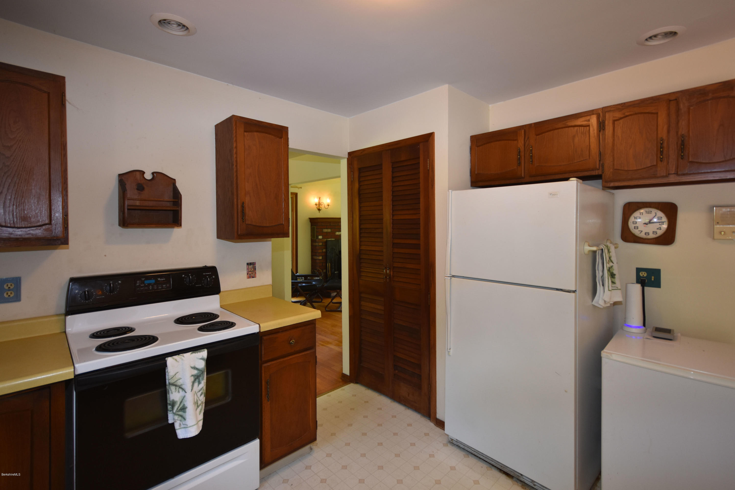 247 East Windsor Road Peru, MA 01235 - Photo 13 of 42 a kitchen with a refrigerator and a stove