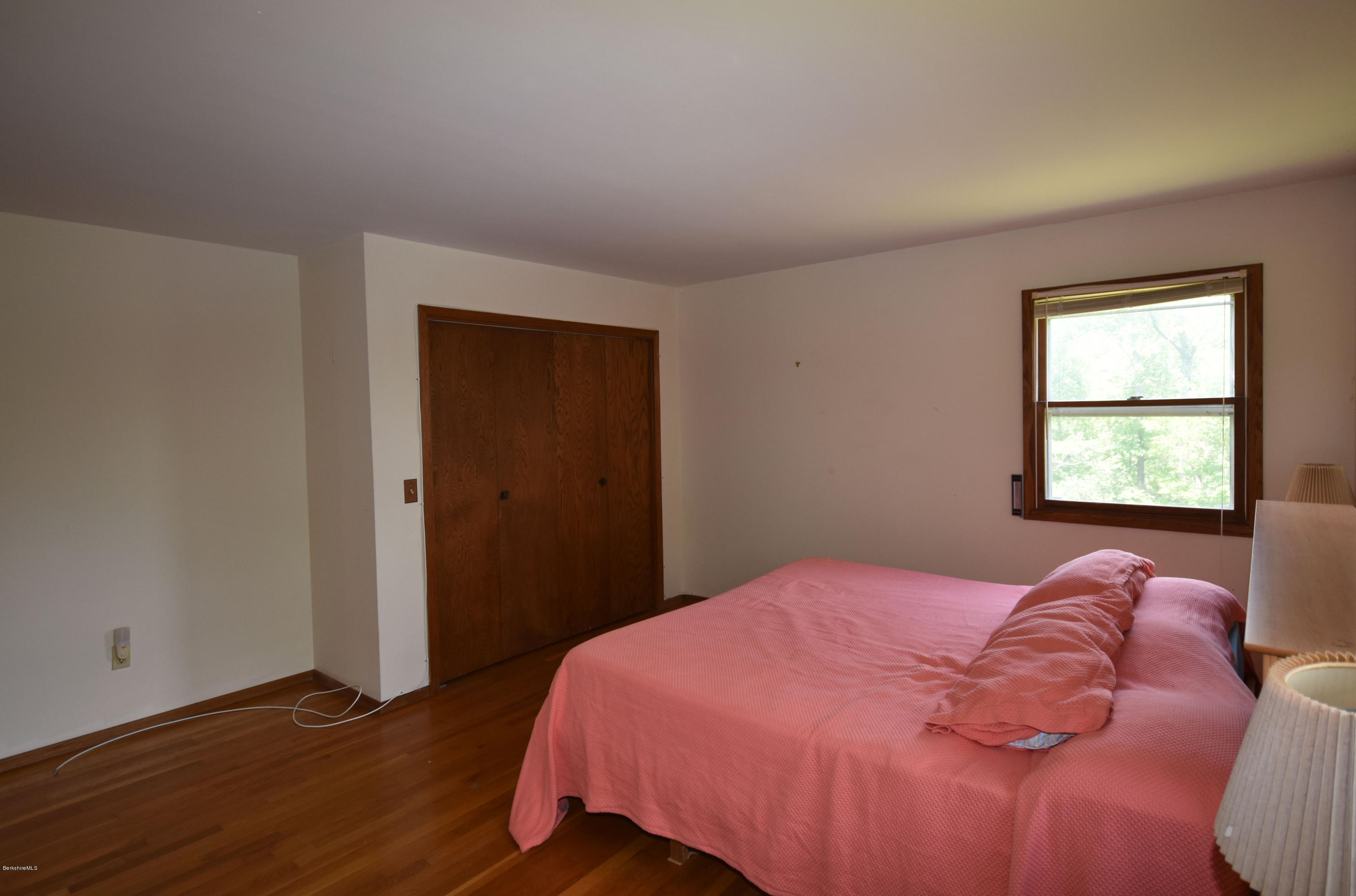 247 East Windsor Road Peru, MA 01235 - Photo 21 of 42 a bedroom with a bed and a window
