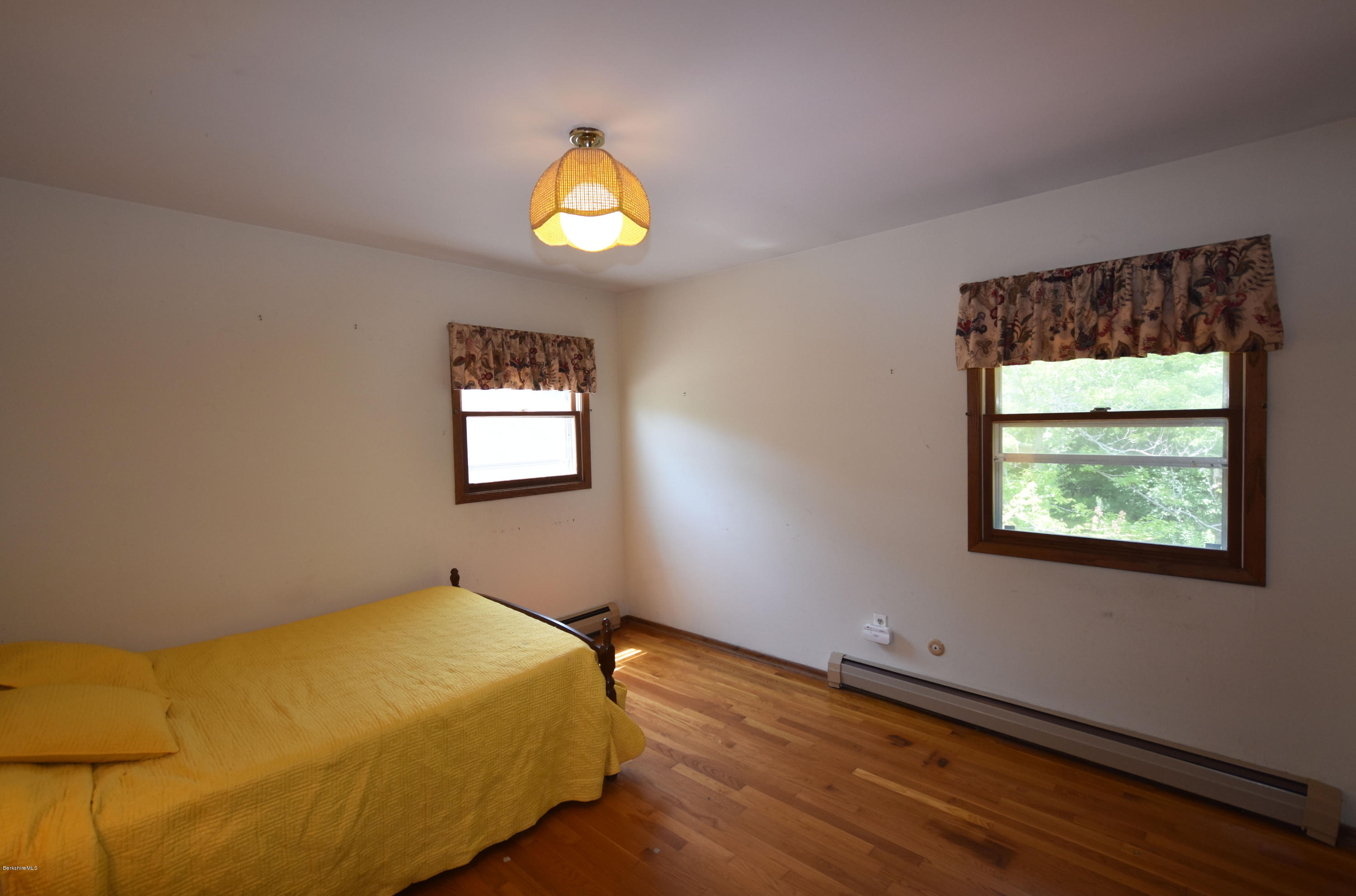 247 East Windsor Road Peru, MA 01235 - Photo 29 of 42 a bed room with a bed and a window