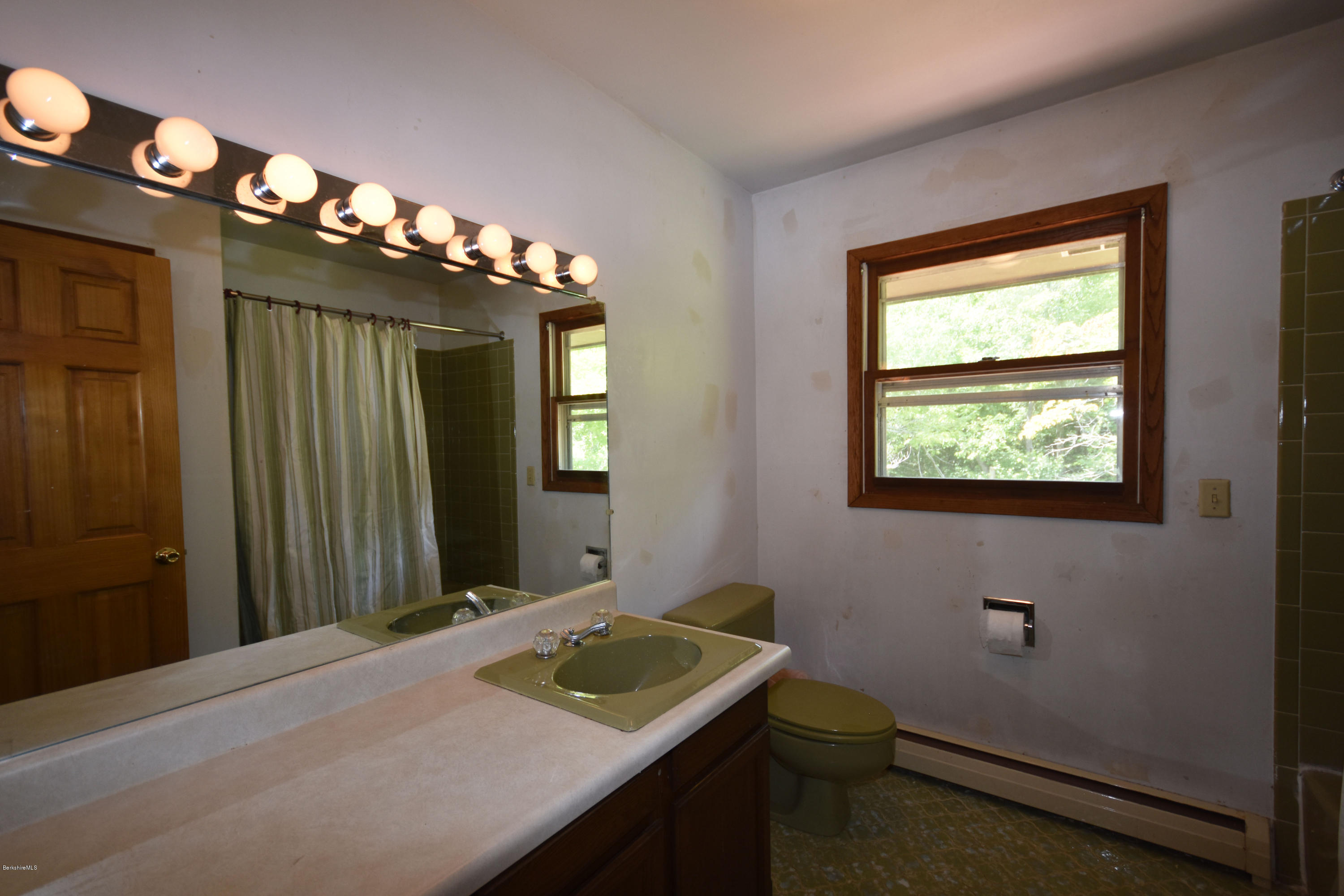 247 East Windsor Road Peru, MA 01235 - Photo 31 of 42 a bathroom with a sink a mirror and a toilet