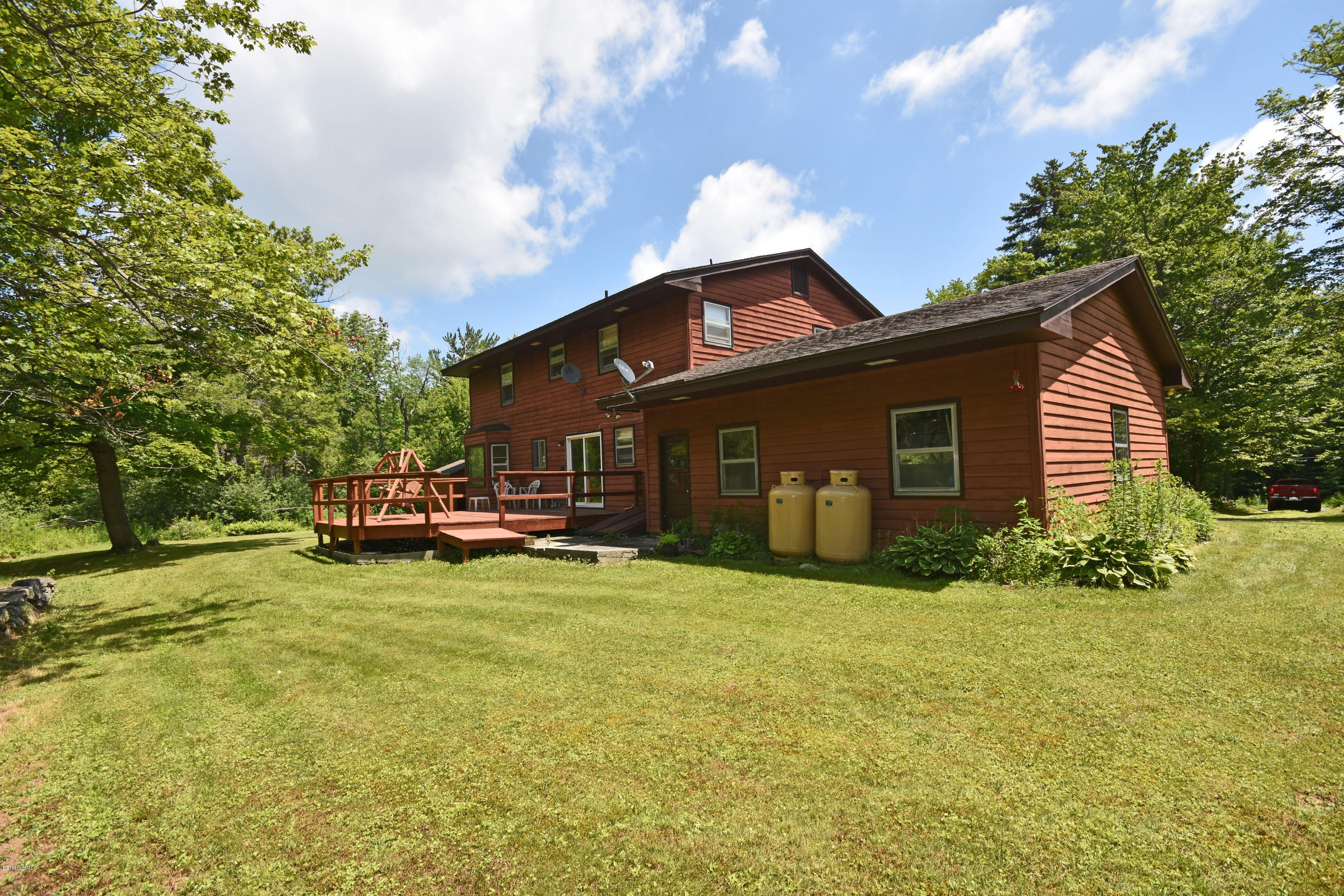 247 East Windsor Road Peru, MA 01235 - Photo 39 of 42 a view of a house with backyard sitting area and garden