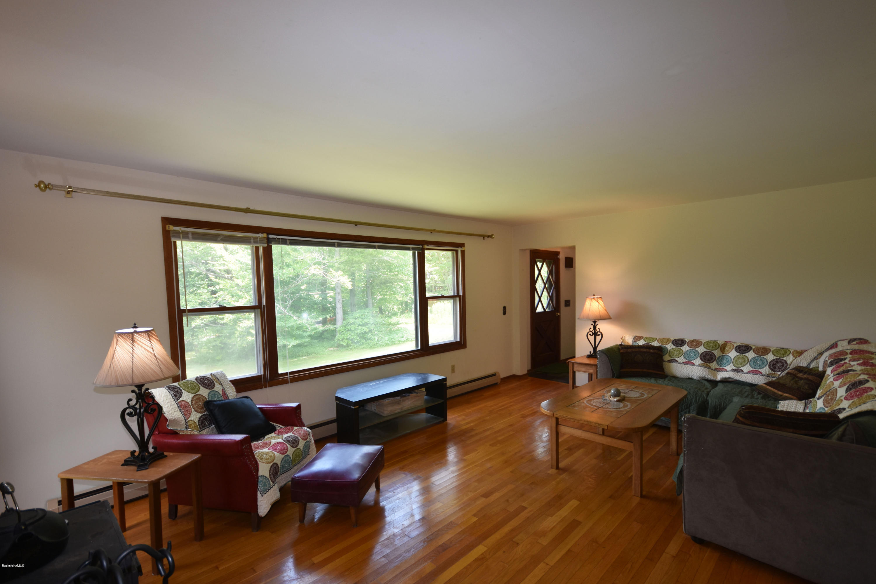 247 East Windsor Road Peru, MA 01235 - Photo 6 of 42 a living room with furniture and large windows