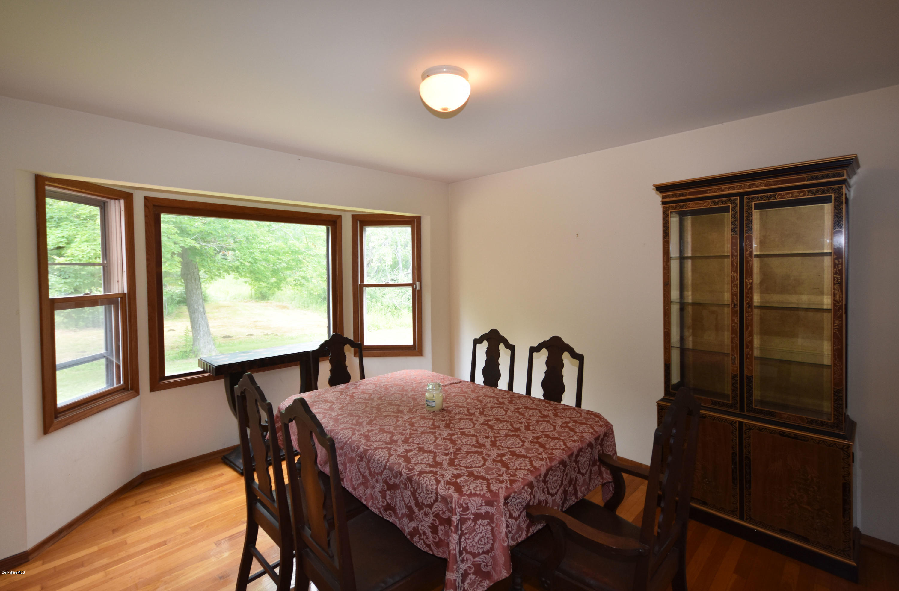 247 East Windsor Road Peru, MA 01235 - Photo 8 of 42 a view of a dining room with furniture window and wooden floor