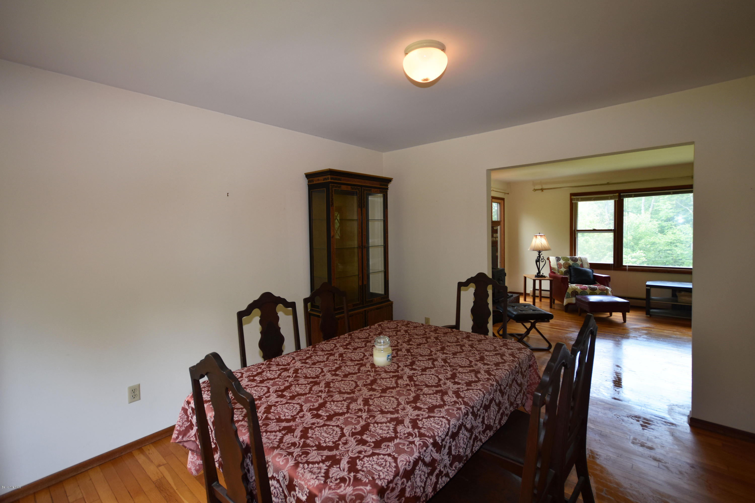 247 East Windsor Road Peru, MA 01235 - Photo 9 of 42 a dining room with furniture and wooden floor