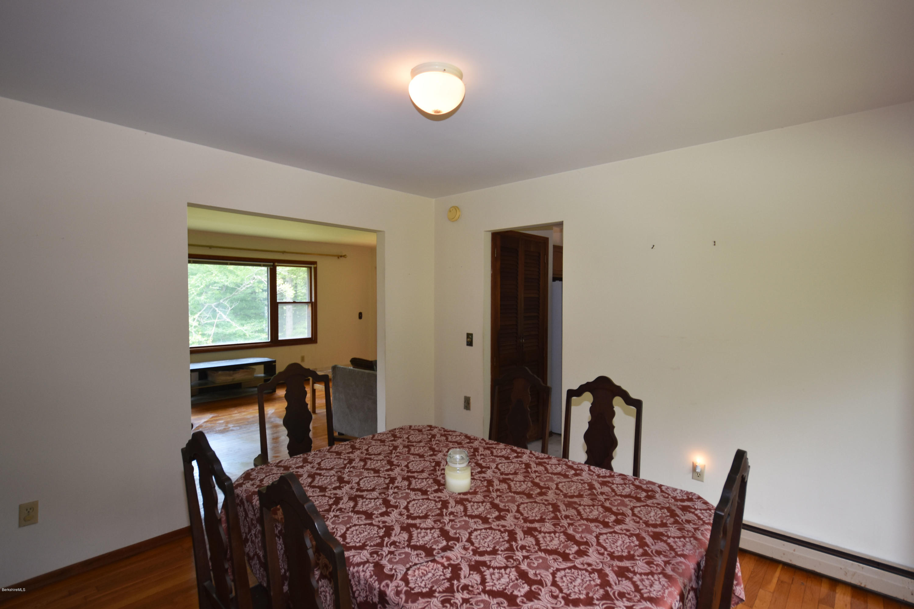 247 East Windsor Road Peru, MA 01235 - Photo 10 of 42 a bedroom with a bed and a table in it