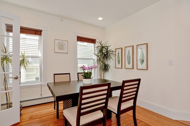a kitchen with a table and chairs in it