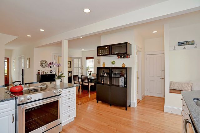 a bedroom with a bed and a potted plant