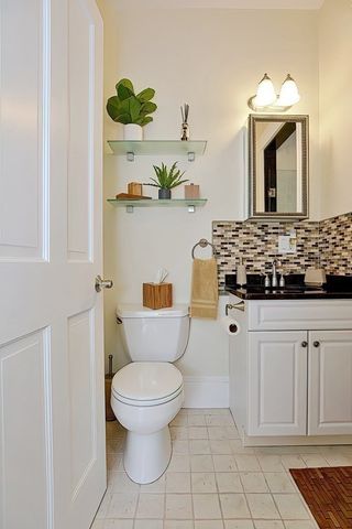 a view of a chairs and table in the balcony