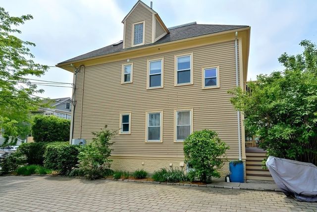 a picture of a room with a white wall and sign
