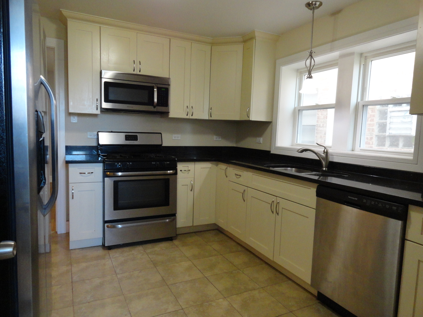 1410 Maple Avenue, Unit 1 Berwyn, IL 60402 - Photo 11 of 15 a kitchen with a sink stove and microwave