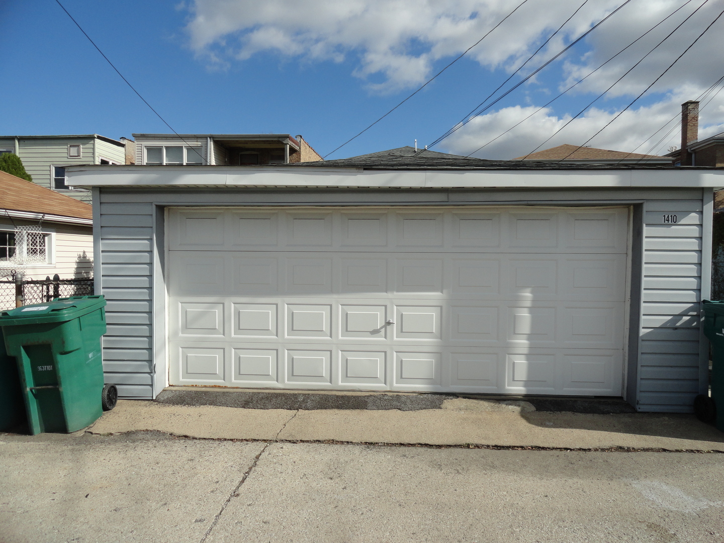 1410 Maple Avenue, Unit 1 Berwyn, IL 60402 - Photo 15 of 15 a front view of a house with a garage