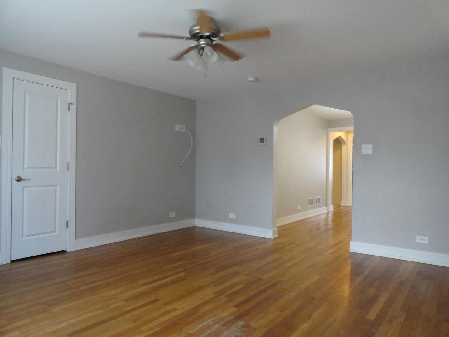 1410 Maple Avenue, Unit 1 Berwyn, IL 60402 - Photo 2 of 15 wooden floor in an empty room with a window