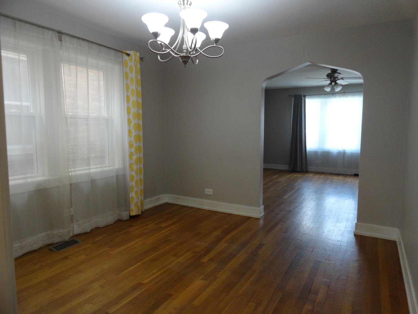1410 Maple Avenue, Unit 1 Berwyn, IL 60402 - Photo 5 of 15 wooden floor in an empty room with a window