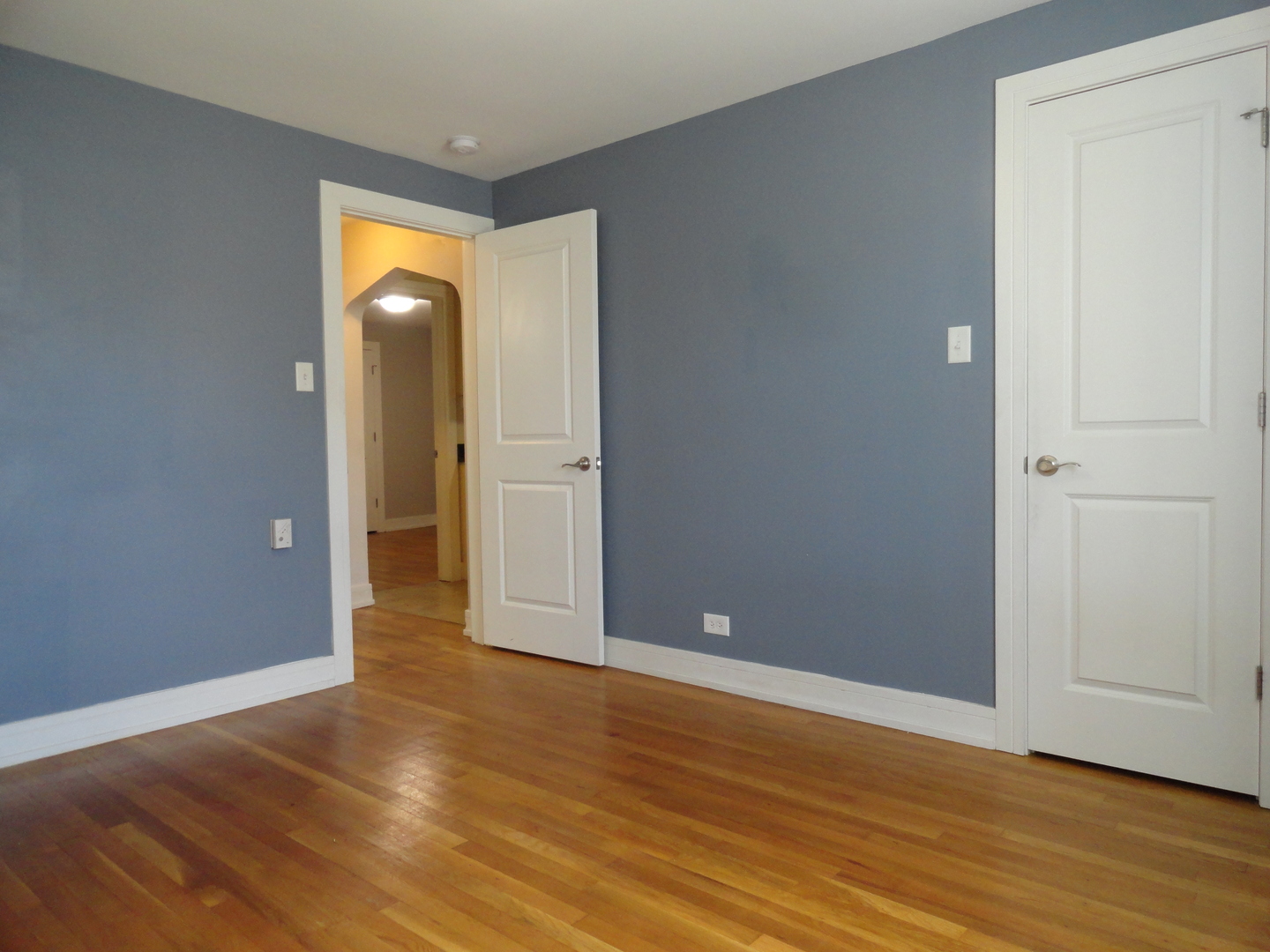 1410 Maple Avenue, Unit 1 Berwyn, IL 60402 - Photo 6 of 15 a view of empty room with wooden floor