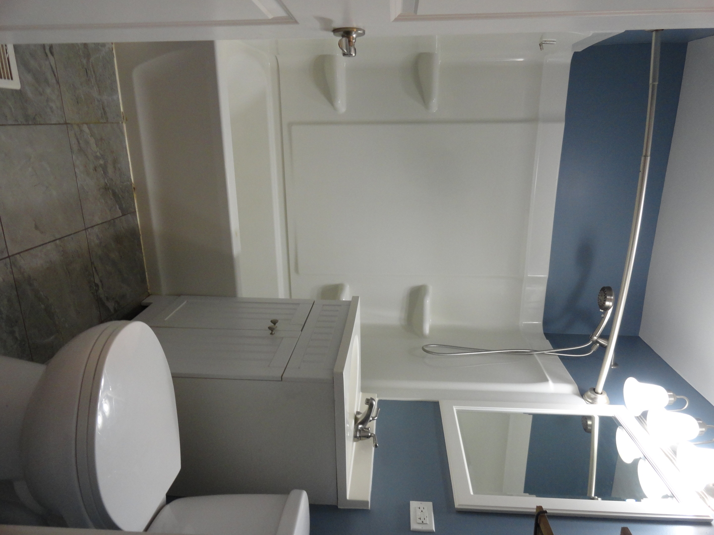 1410 Maple Avenue, Unit 1 Berwyn, IL 60402 - Photo 10 of 15 a bathroom with a toilet and a mirror