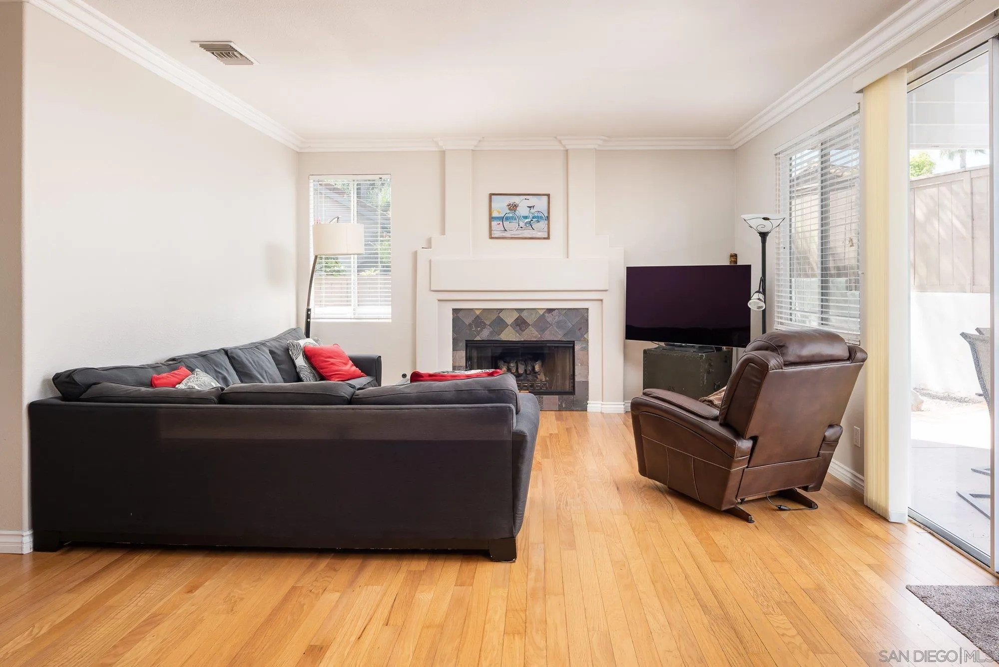 657 Cantara Lane Vista, CA 92081 - Photo 17 of 61 a living room with furniture and a fireplace