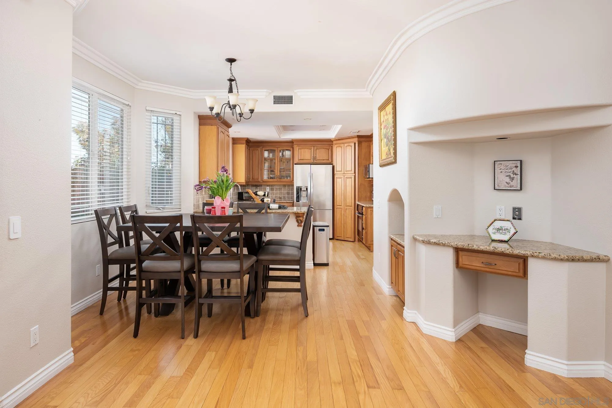 657 Cantara Lane Vista, CA 92081 - Photo 20 of 61 a view of a dining room with furniture and wooden floor