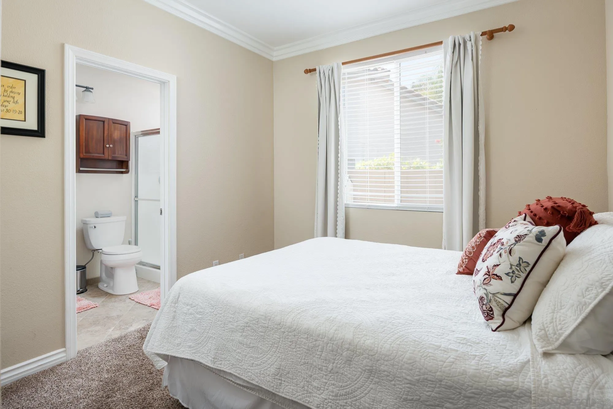 657 Cantara Lane Vista, CA 92081 - Photo 23 of 61 a bedroom with a bed and a window