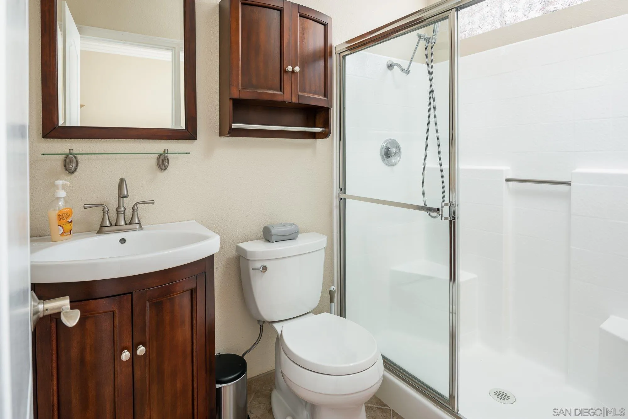 657 Cantara Lane Vista, CA 92081 - Photo 24 of 61 a bathroom with a sink a toilet and shower
