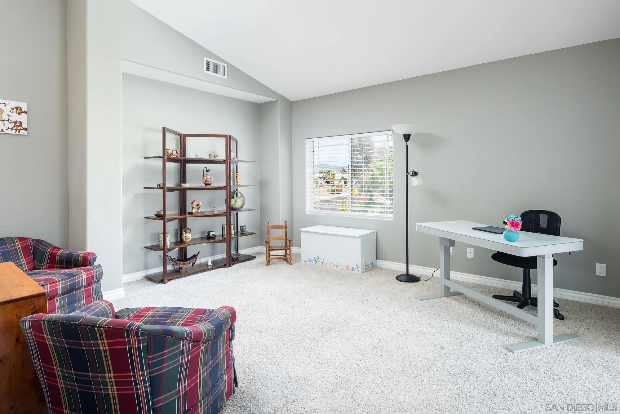 657 Cantara Lane Vista, CA 92081 - Photo 26 of 61 a room with furniture and a window