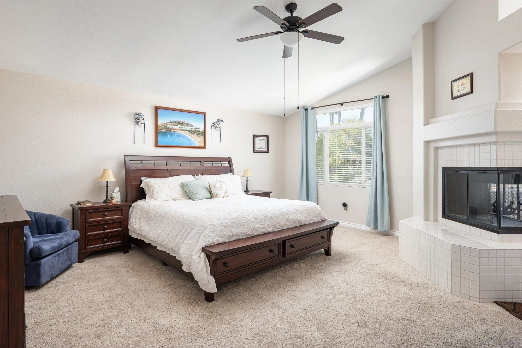 657 Cantara Lane Vista, CA 92081 - Photo 30 of 61 a spacious bedroom with a bed and a fireplace
