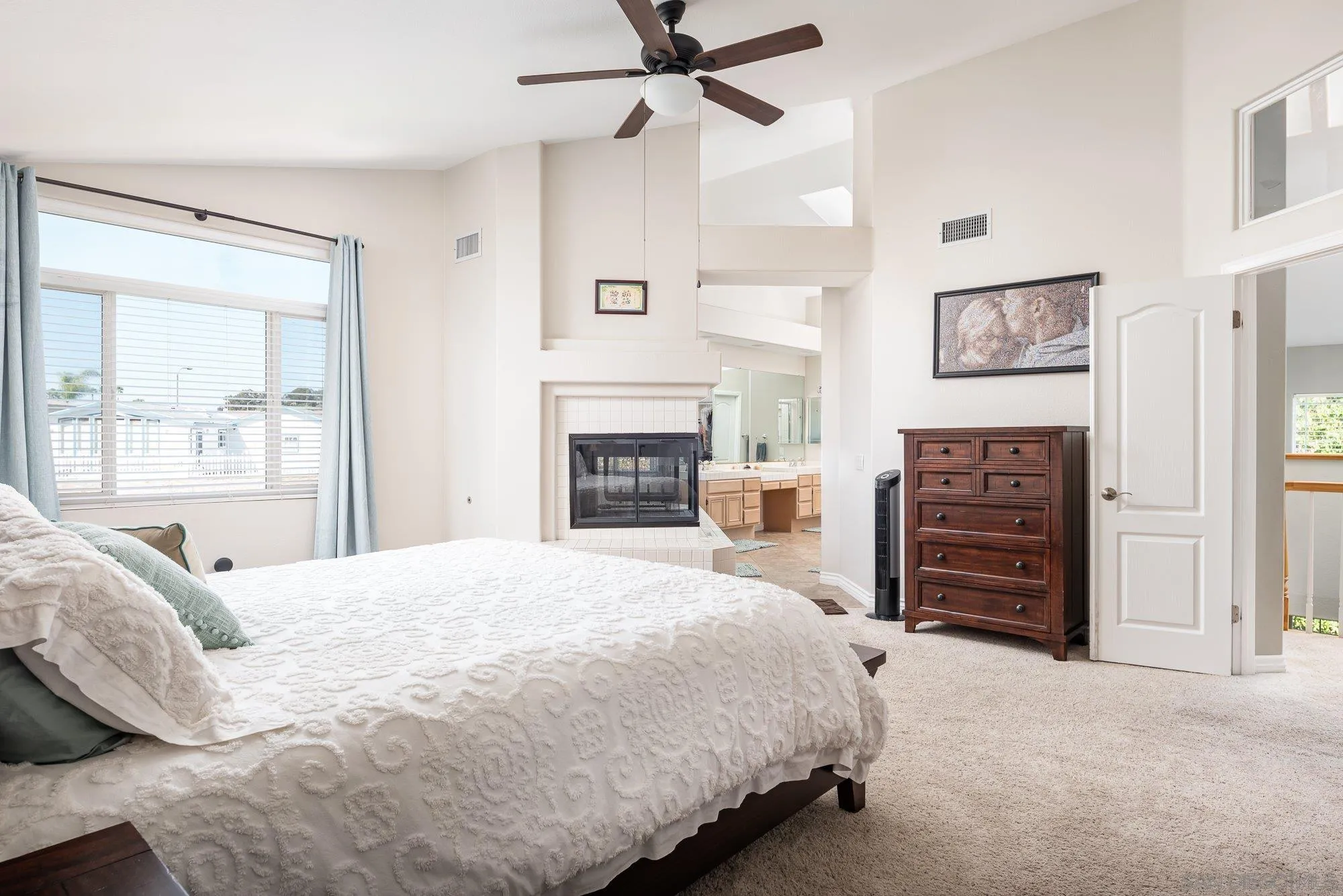 657 Cantara Lane Vista, CA 92081 - Photo 31 of 61 a bedroom with a bed and a dresser