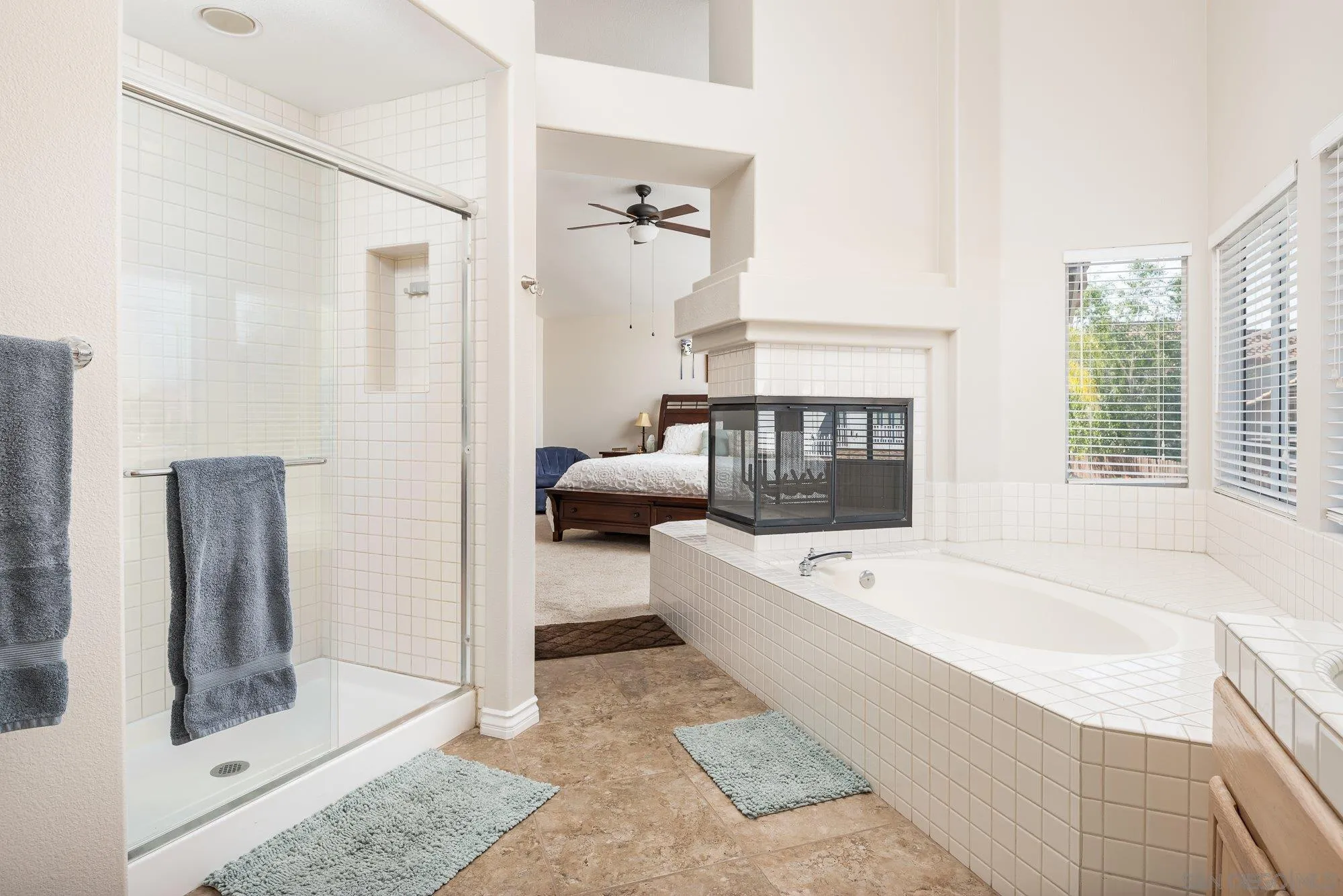 657 Cantara Lane Vista, CA 92081 - Photo 35 of 61 a bathroom with a tub a sink and a shower