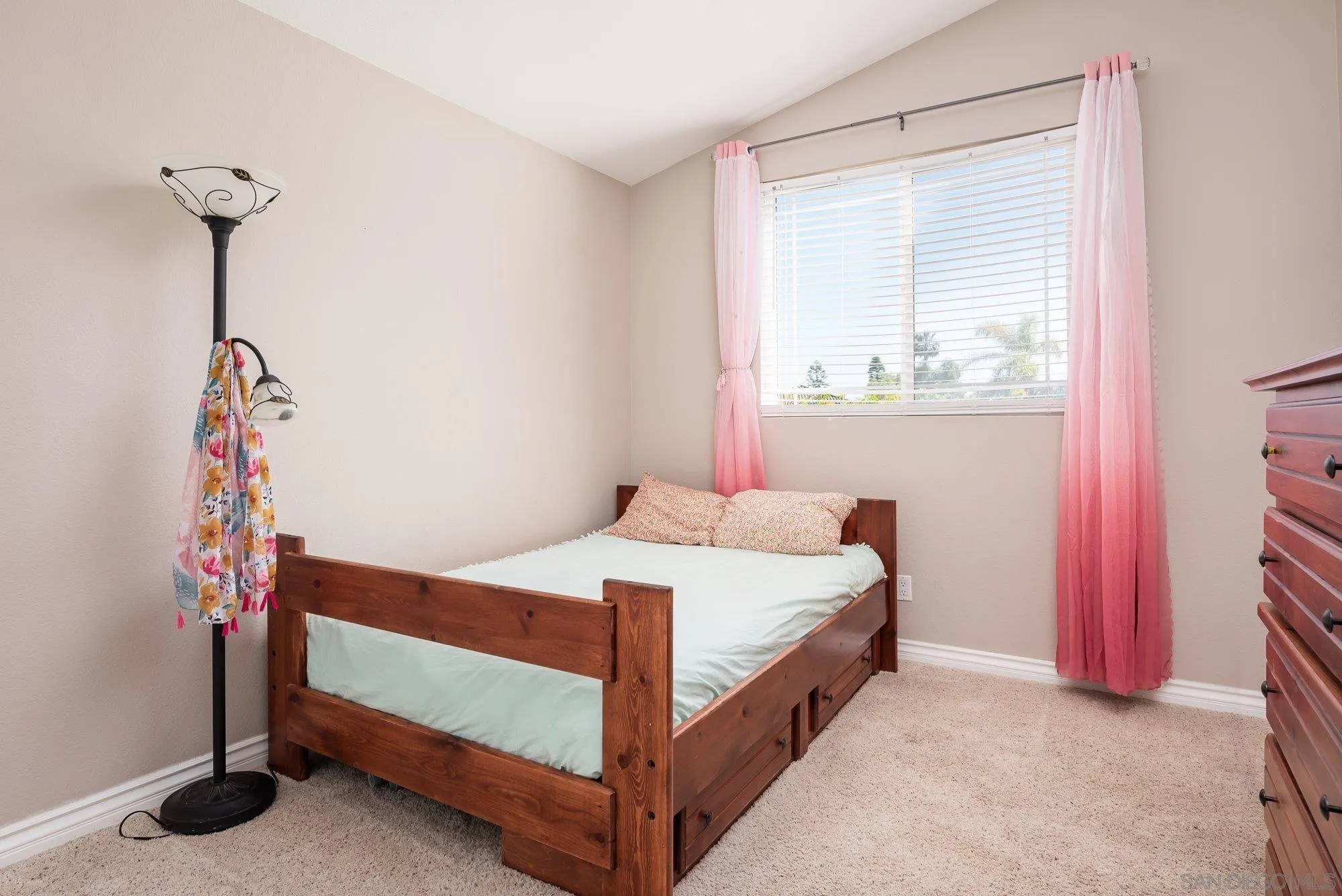 657 Cantara Lane Vista, CA 92081 - Photo 38 of 61 a bedroom with a bed and a window