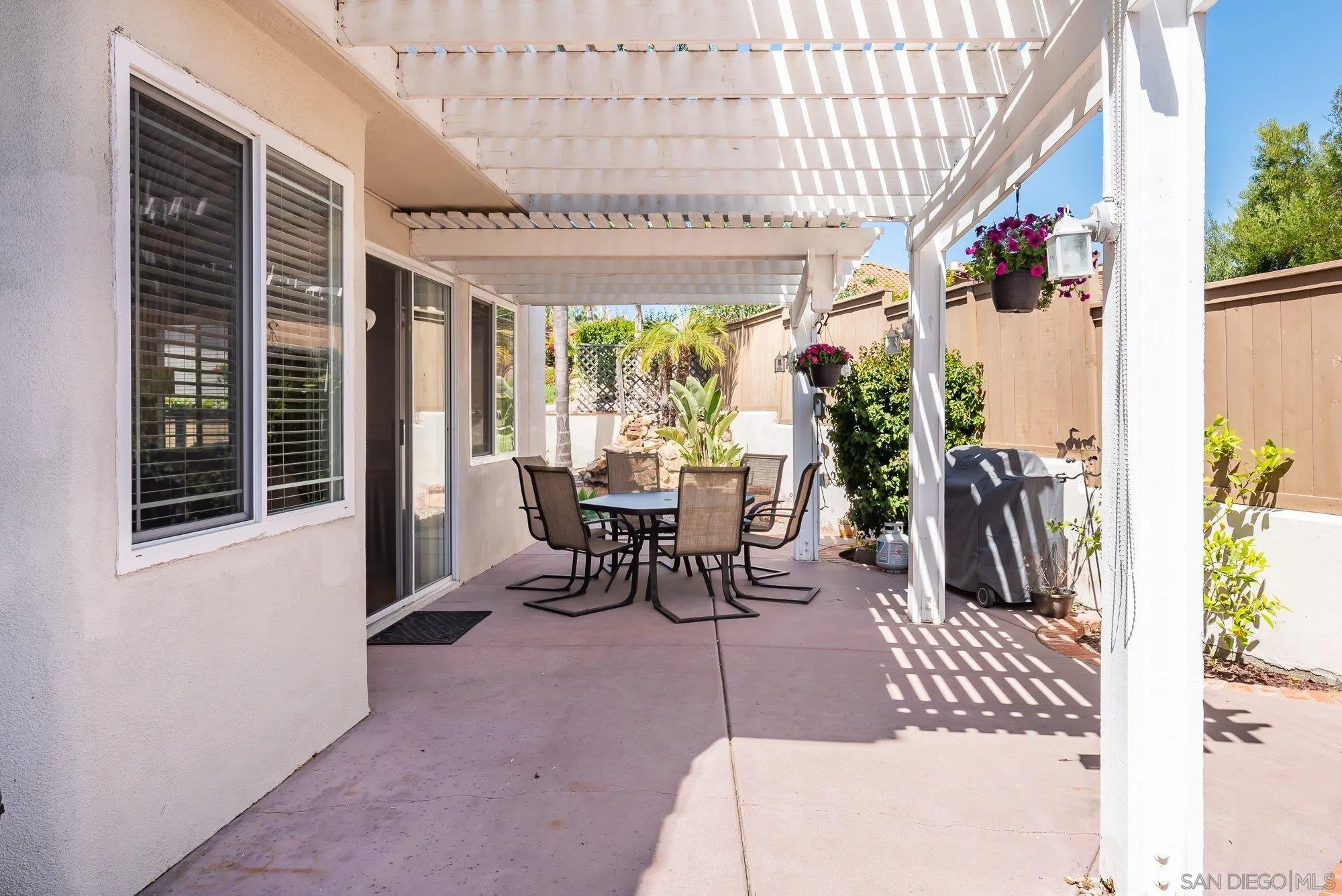 657 Cantara Lane Vista, CA 92081 - Photo 43 of 61 a dining room with furniture water view and a potted plant