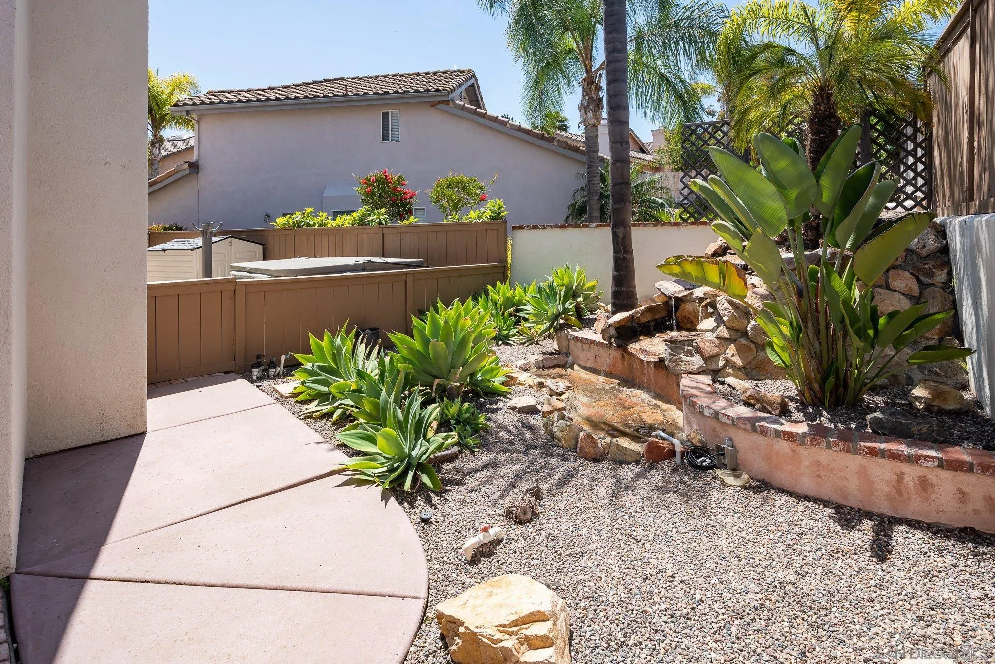 657 Cantara Lane Vista, CA 92081 - Photo 45 of 61 a potted plant sitting in front of a house
