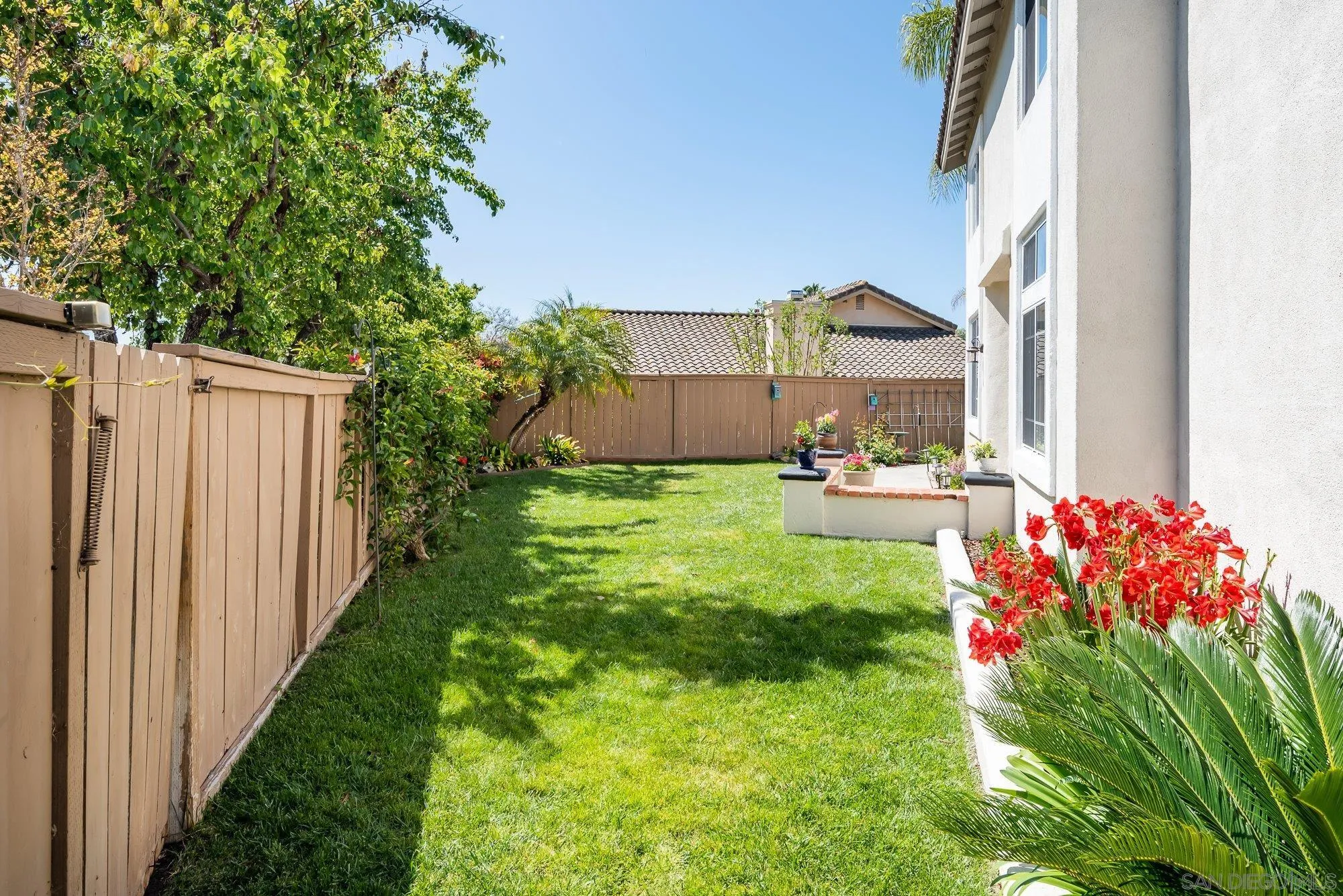 657 Cantara Lane Vista, CA 92081 - Photo 49 of 61 a view of a house with a yard and table and chair