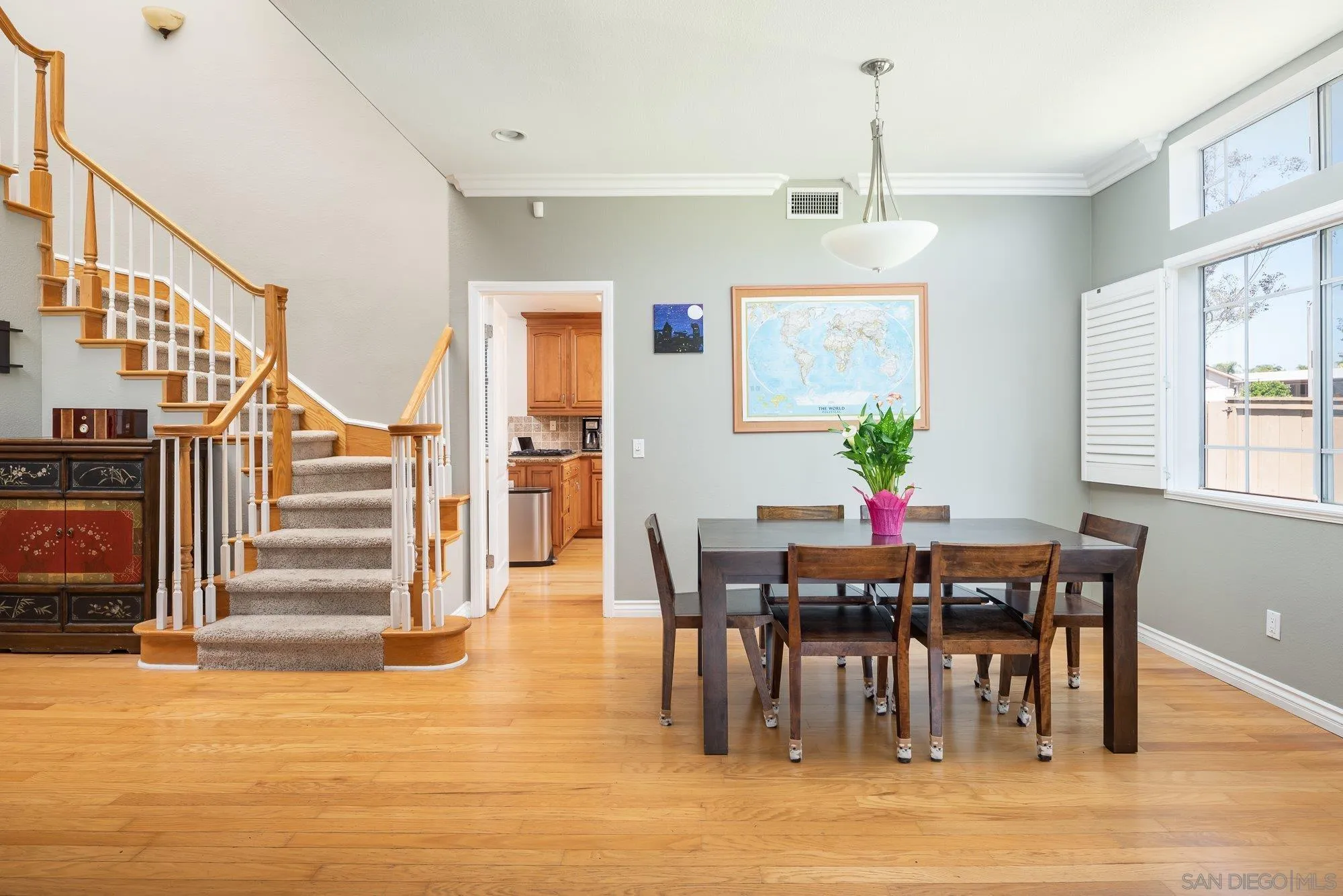 657 Cantara Lane Vista, CA 92081 - Photo 10 of 61 a view of a dining room with furniture and wooden floor