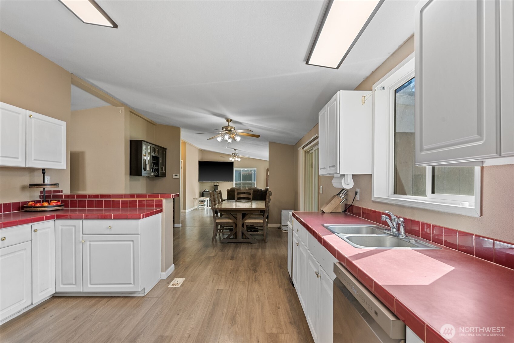 14934 Golden Delicious Street Entiat, WA 98822 - Photo 11 of 33 a kitchen with a sink stove and wooden cabinets