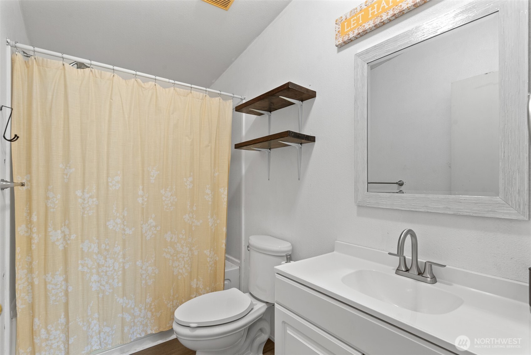 14934 Golden Delicious Street Entiat, WA 98822 - Photo 24 of 33 a bathroom with a sink a toilet and shower curtain