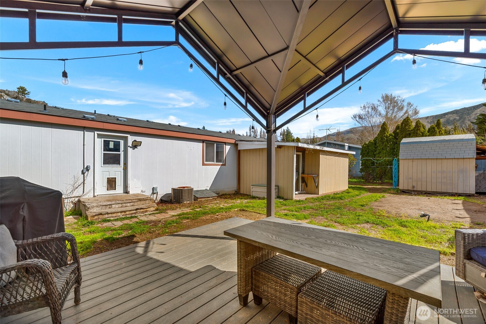 14934 Golden Delicious Street Entiat, WA 98822 - Photo 30 of 33 a view of backyard with swimming pool and seating space