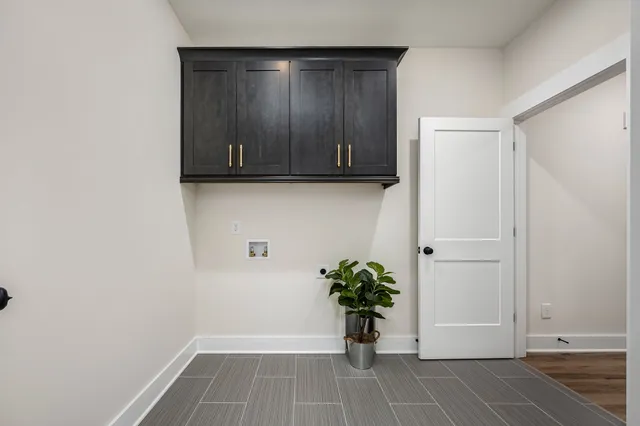 a view of a livingroom with furniture and bathroom