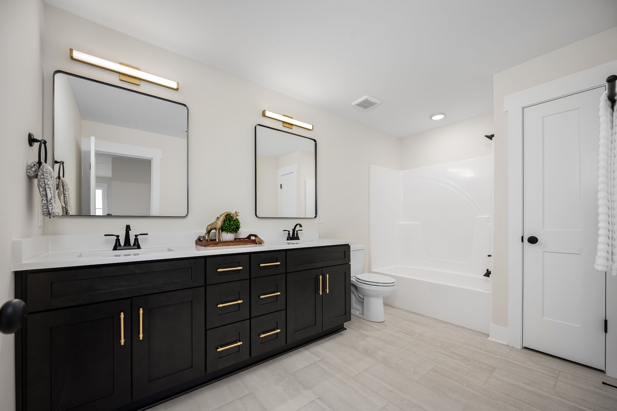 7302 West Gum Road Murfreesboro, TN 37127 - Photo 39 of 53 a bathroom with a double vanity sink and mirror with toilet
