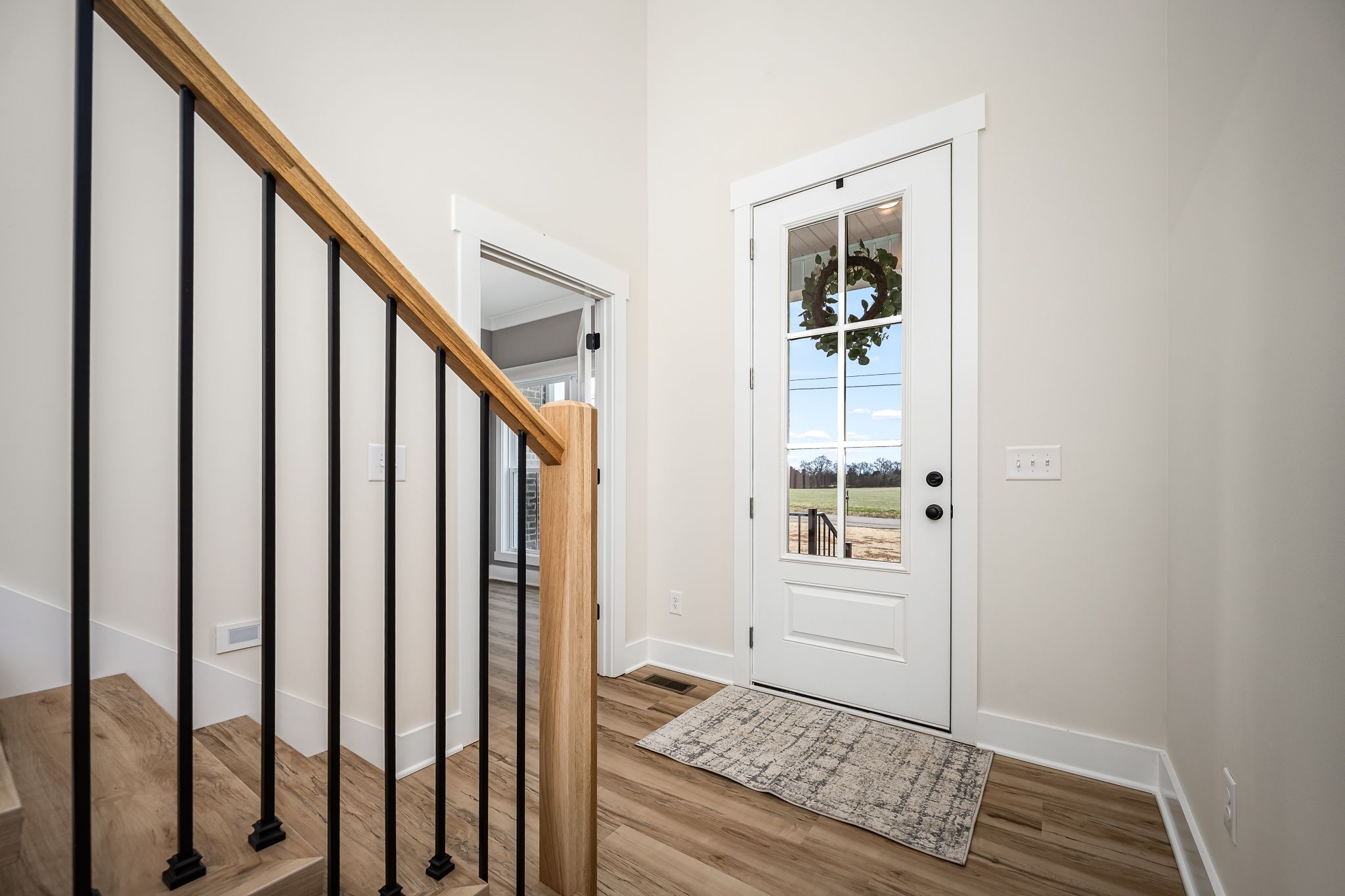 7302 West Gum Road Murfreesboro, TN 37127 - Photo 6 of 53 a view of an entryway with wooden floor and stairs