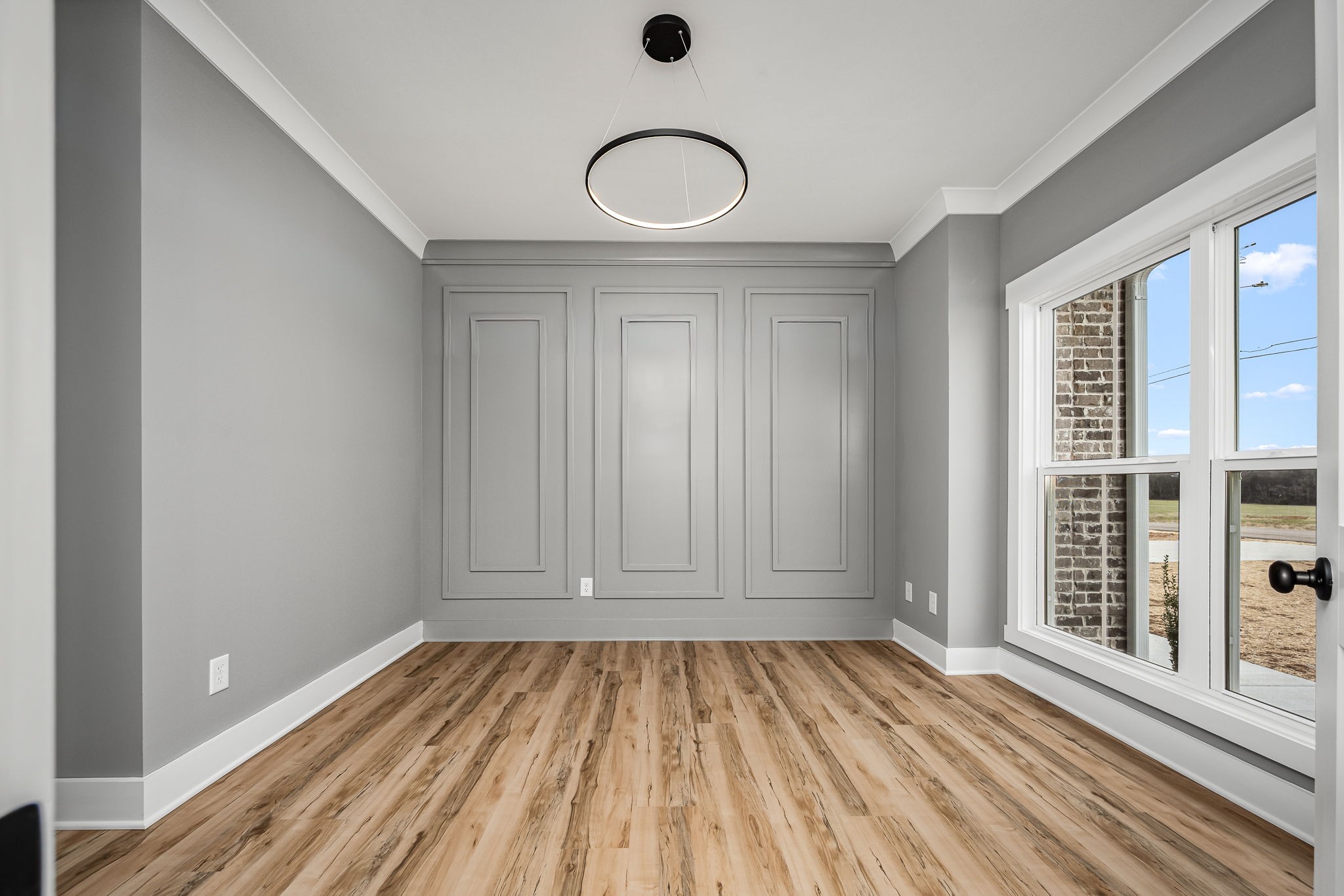 7302 West Gum Road Murfreesboro, TN 37127 - Photo 8 of 53 an empty room with wooden floor and windows