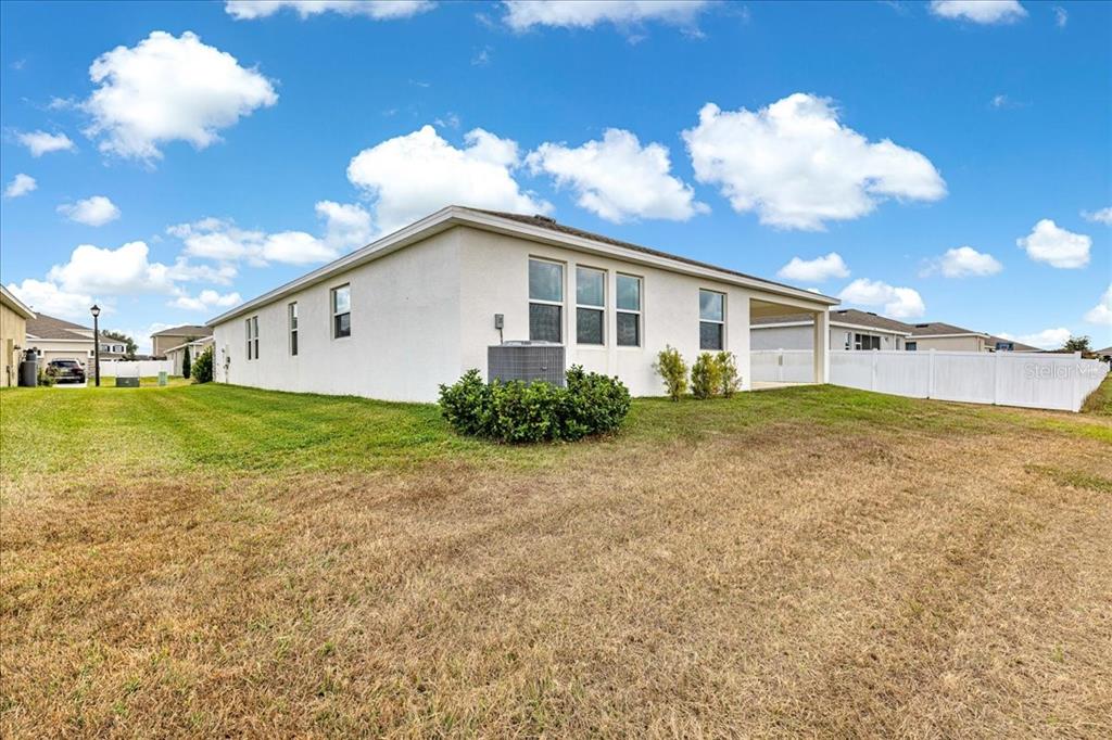 5851 Southwest 85th Place Ocala, FL 34476 - Photo 46 of 57 a view of a house with a big yard