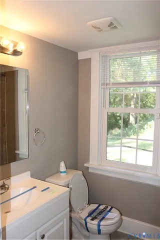 a bathroom with a sink a toilet and tub