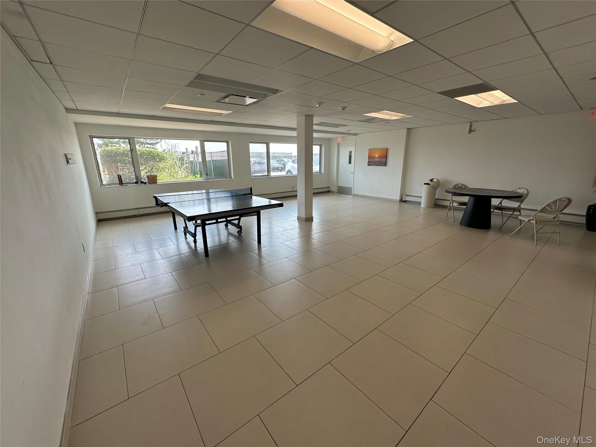 830 Shore Road, Unit 5T Long Beach, NY 11561 - Photo 17 of 18 a lobby with furniture and a floor to ceiling window