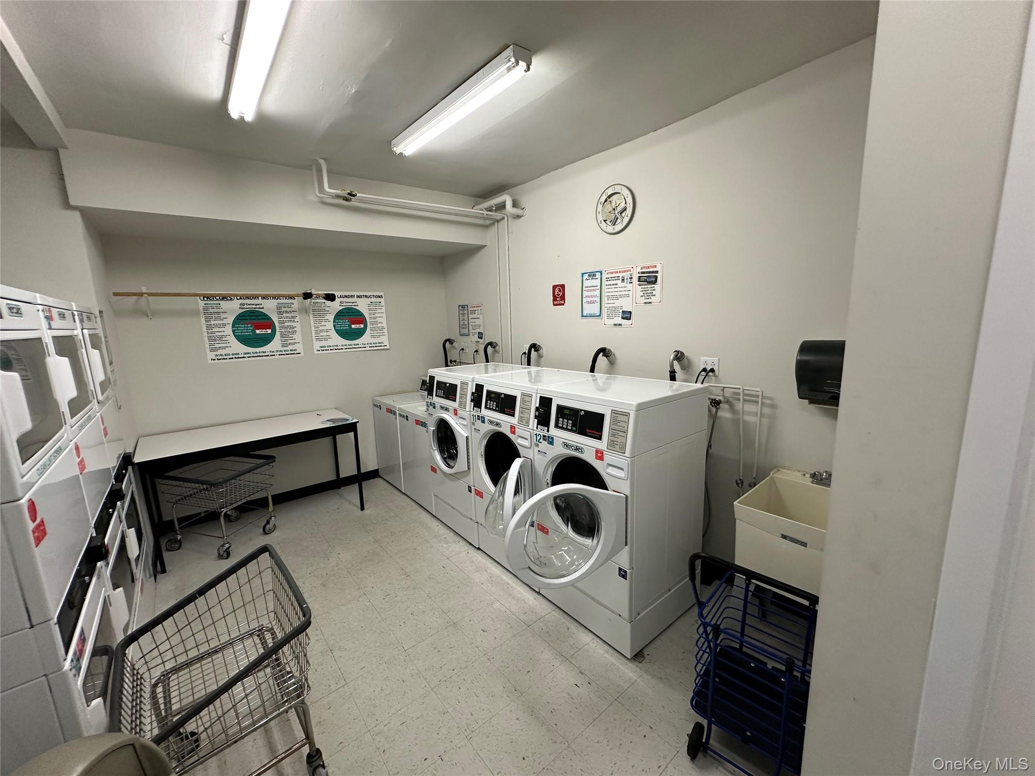 830 Shore Road, Unit 5T Long Beach, NY 11561 - Photo 18 of 18 a utility room with dryer and washer