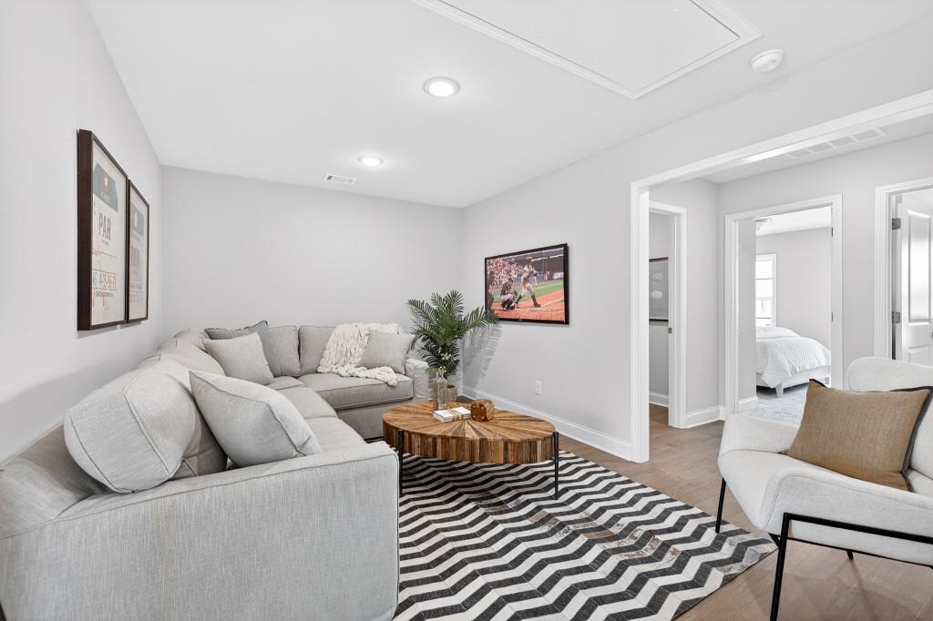 2789 Apperson Way Suwanee, GA 30024 - Photo 11 of 37 a living room with furniture and a rug