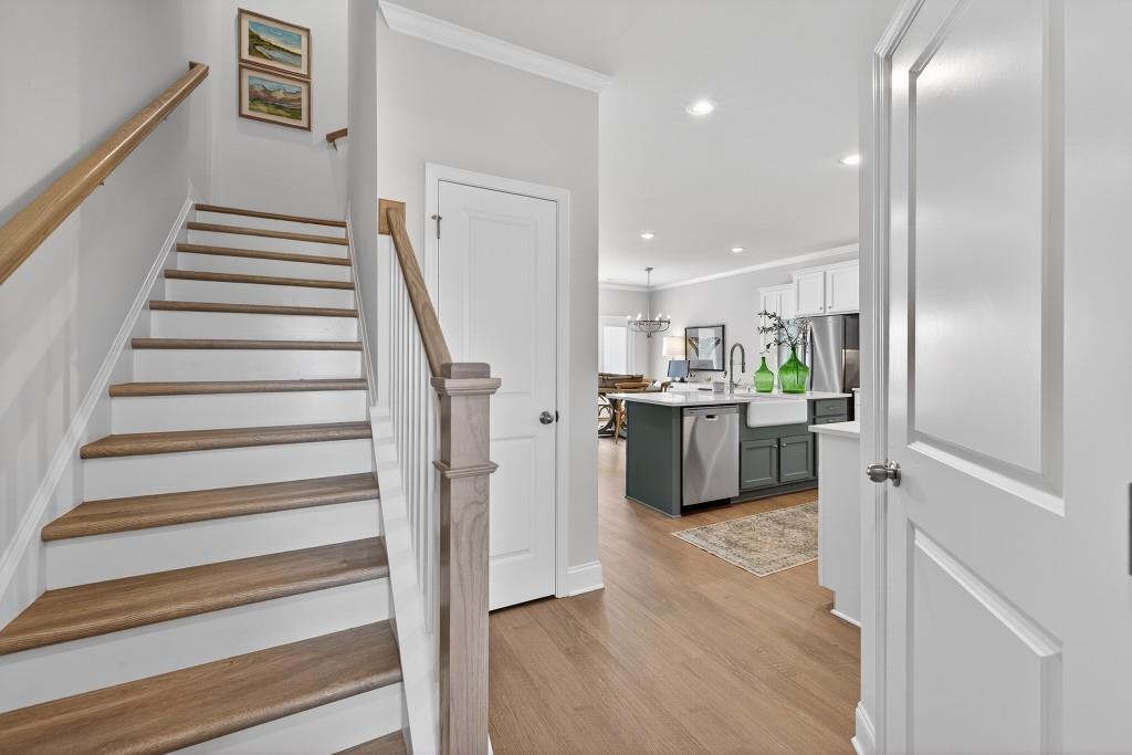 2789 Apperson Way Suwanee, GA 30024 - Photo 2 of 37 a open kitchen with white cabinets and stainless steel appliances